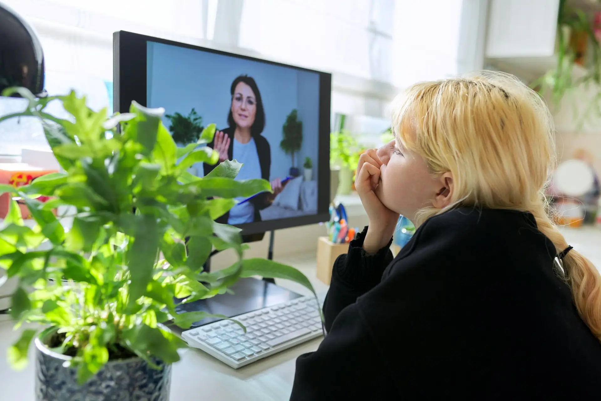 Online session of a psychologist, counselor with a female teenager